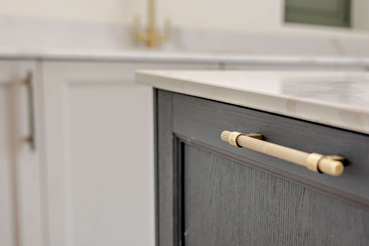 Brass handle on a painted drawer